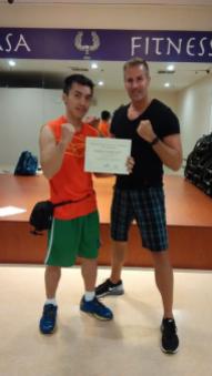 Certified Kickboxing Instructor in 2015 by IFTA. Photo with Greg Sims (Director of Operations)